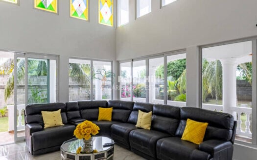 Elegant 6-Bedroom Villa with River Views and Tropical Gardens in Sabaneta de Yásica